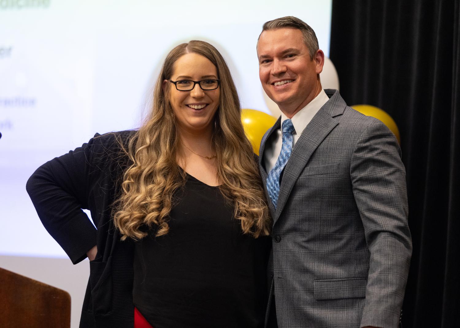 Graduate Dr. Amy Cooper and Program Director Joshua Harbert 