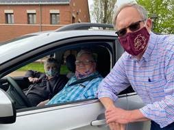 Stow Mayor John Pribonic visits with seniors as they arrive at Farmer's Market Drive-thru