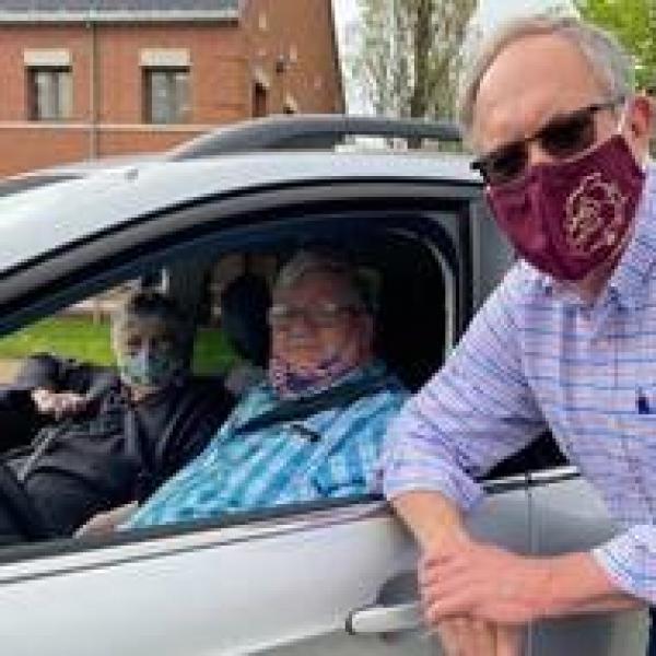 Stow Mayor John Pribonic visits with seniors as they arrive at Farmer's Market Drive-thru